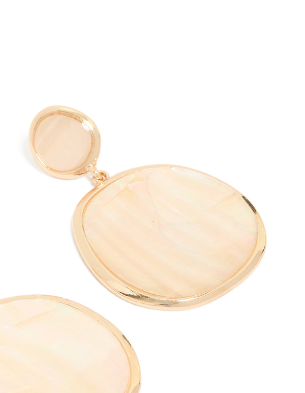 Elegant pink shell double circle drop earrings in gold featuring statement styling and ocean motifs post detail view