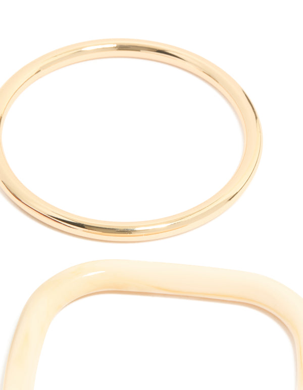 Crafted from resin, thin bangle in gold tones close up view