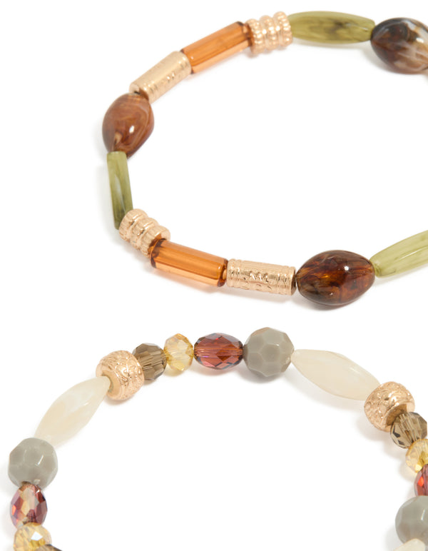 Crafted with neutral acrylic irregular beaded stretch bracelets in a 4-pack, showcasing chunky design in olive, orange, and sienna close up view