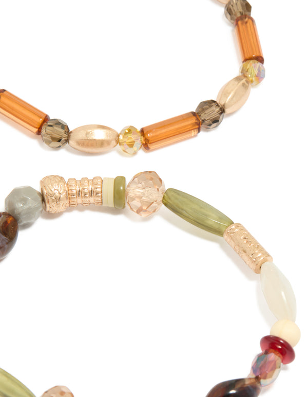 Crafted with neutral acrylic irregular beaded stretch bracelets in a 4-pack, showcasing chunky design in olive, orange, and sienna close up view