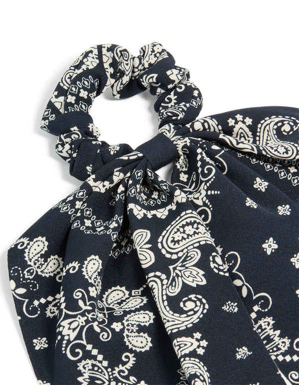 This paisley printed scarf scrunchie comes in black and ivory with statement design side view