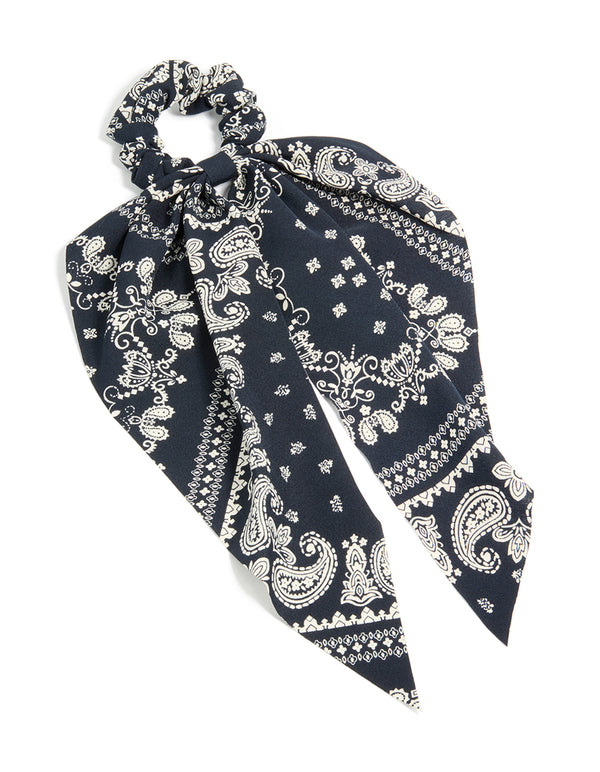 Featuring a paisley printed scarf scrunchie in black and ivory with statement style front view