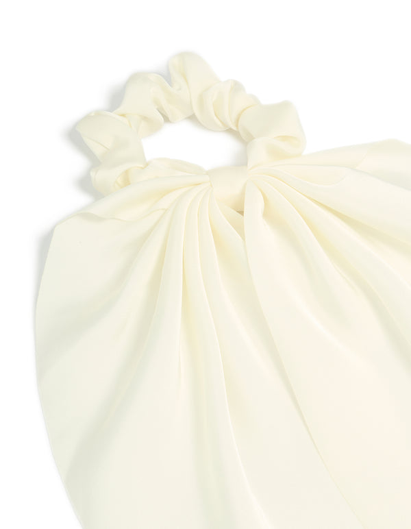 Featuring a solid ivory design, this simple cream long scarf scrunchie side view