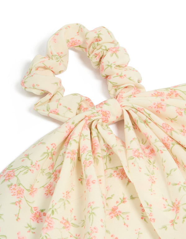 Crafted with pretty pink flower printed scarf scrunchie with leaf and floral pattern in cornsilk, light pink, and pale green side view