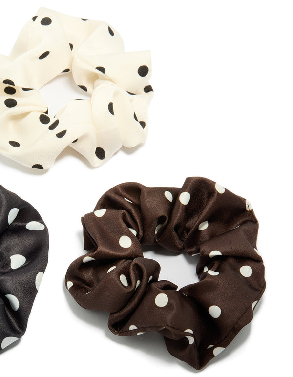 Crafted with polka dot pattern in a 3-pack featuring black, ivory, saddle brown, and white scrunchies side view
