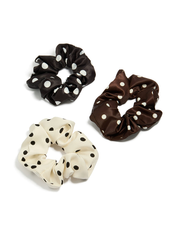 Discover polka dot pattern scrunchies in a 3-pack featuring black, ivory, saddle brown, and white front view