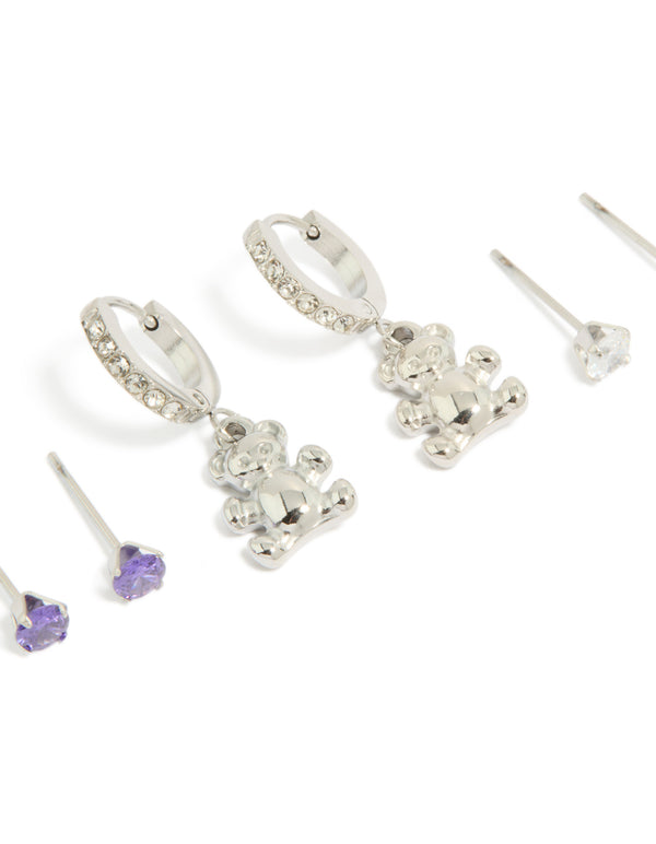 Discover this stainless steel bear earrings 3-pack with cubic zirconia crystals featuring waterproof huggie and stud closures in silver, blueviolet, and white close up view