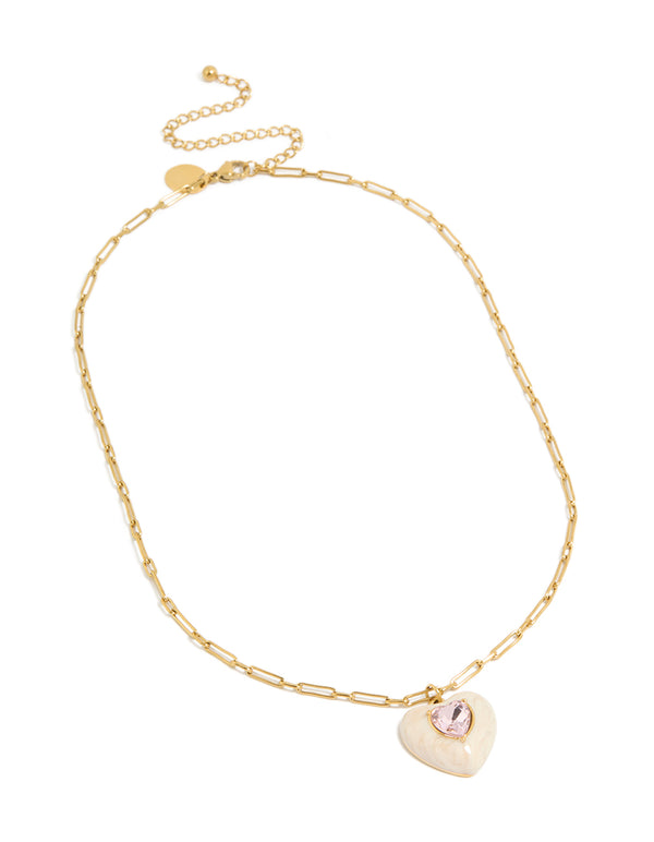 Featuring a gold plated stainless steel statement cream enamel heart necklace with charm pendant featuring waterproof materials front view