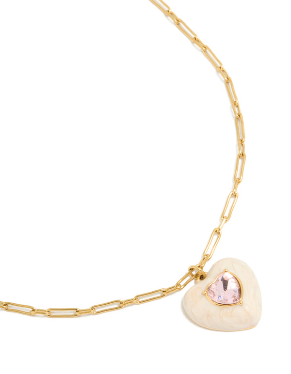 Showcasing a gold plated stainless steel statement cream enamel heart necklace with charm pendant featuring waterproof materials close up view