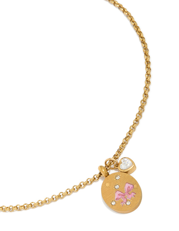 Elegantly crafted gold plated stainless steel necklace with pink bow enamel charm, heart pendant, cubic zirconia, and waterproof disc features front view