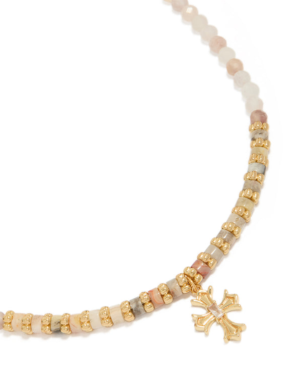 Showcasing a gold plated semi precious stones beaded cross necklace close up view