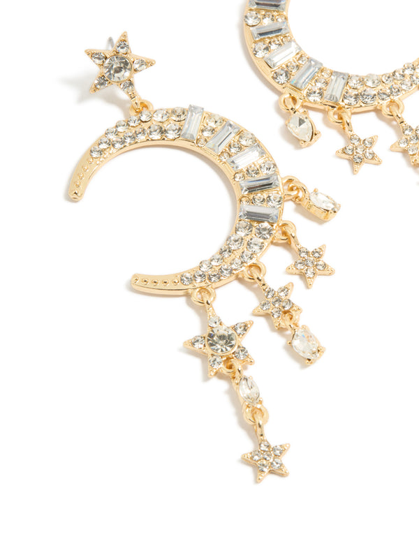 Discover these statement drop earrings with celestial charm accents in gold and diamante close up view
