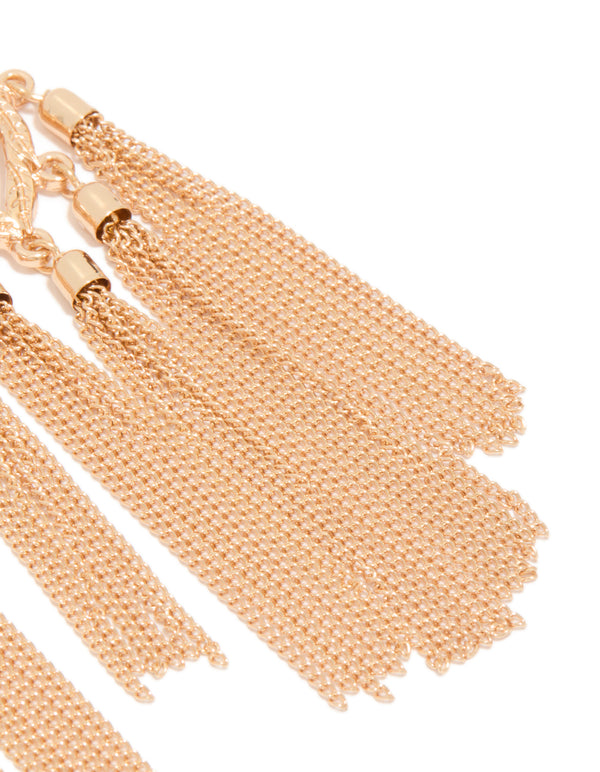 Stunning statement tassel drop earrings in gold with leaf accents and diamante embellishments post detail view