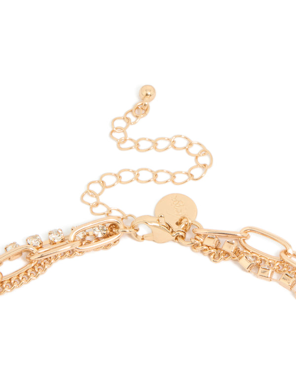 Crafted gold long multi chain tassel necklace featuring statement design clasp detail view
