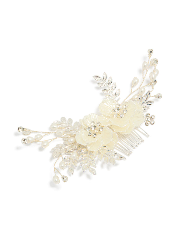 Crafted with floral and leaf accents, this pearlised comb in silver features ivory and white tones detail view