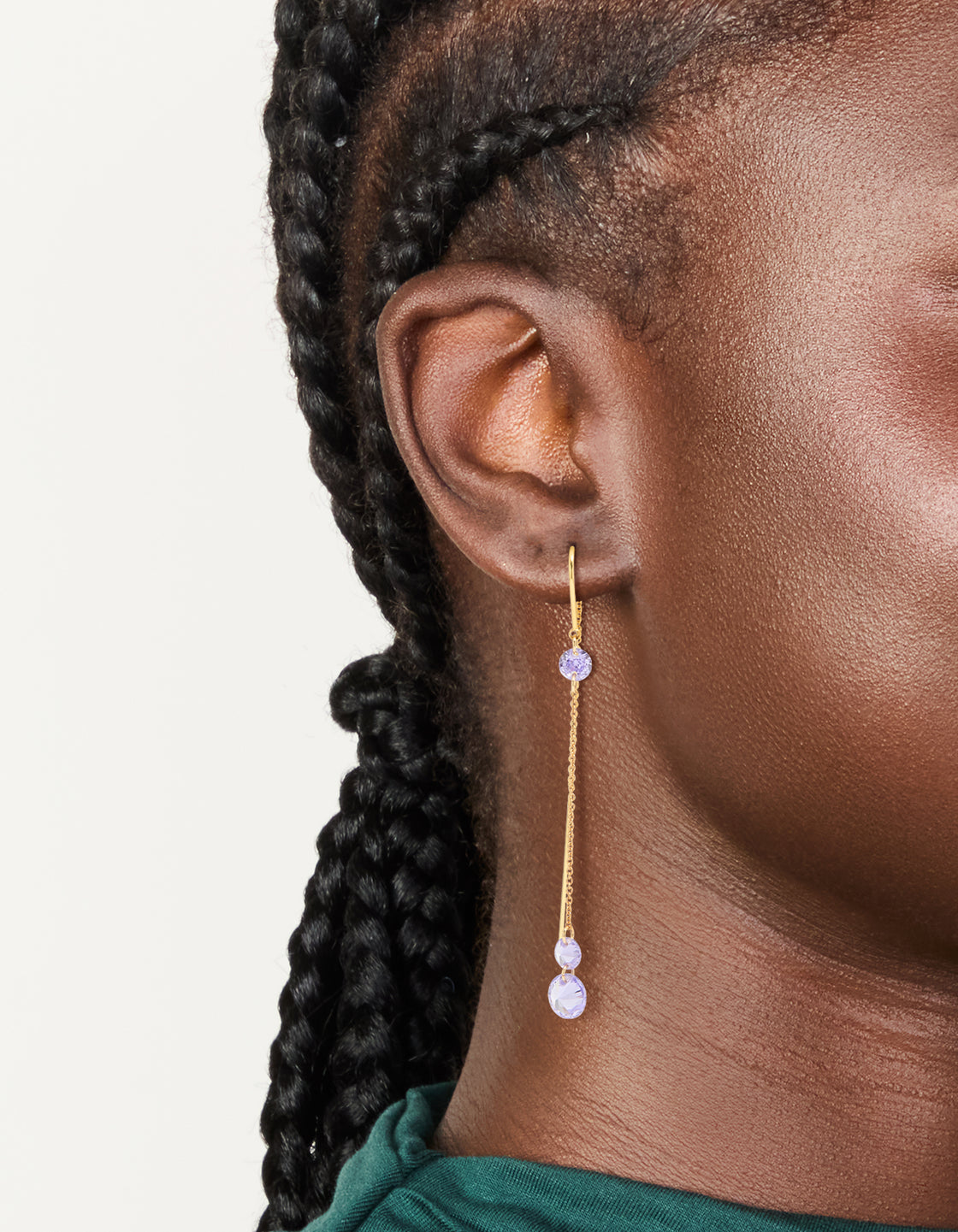 Elegant gold plated purple cubic zirconia drop thread through hook earrings featuring dainty style on ear view