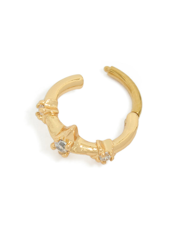 Showcasing a gold plated surgical steel clicker ring featuring multi celestial star with cubic zirconia stones detail view