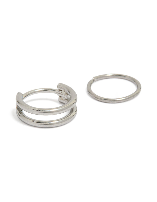 Featuring surgical steel double hinged and plain hoop nose rings in silver front view