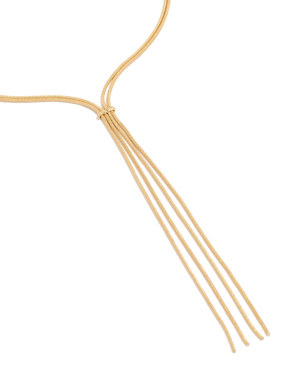 Showcasing a thin tassel Y-necklace crafted from gold plated material close up view