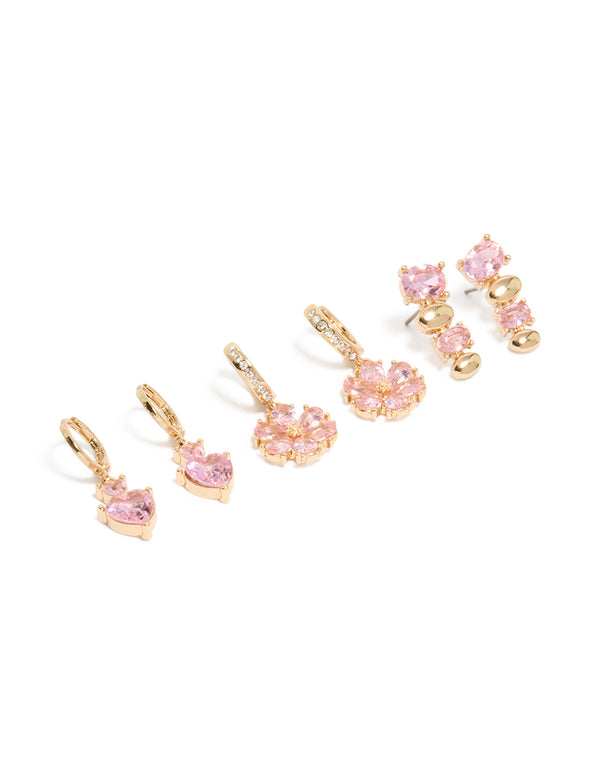 Featuring gold pink diamante flower and heart huggie earrings in a 3-pack with oval stone cut front view