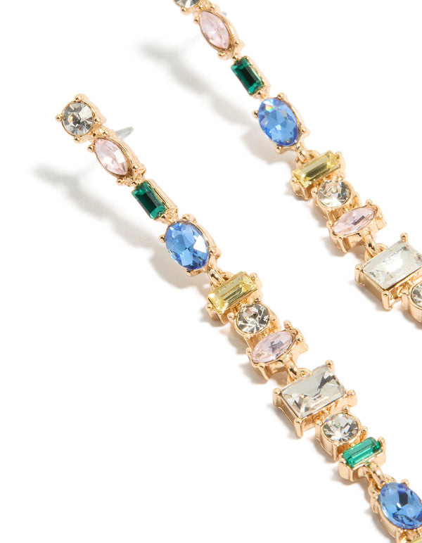Elegant long drop earrings with statement style in gold featuring blue, green, and clear diamantes with oval stone cut in close up view