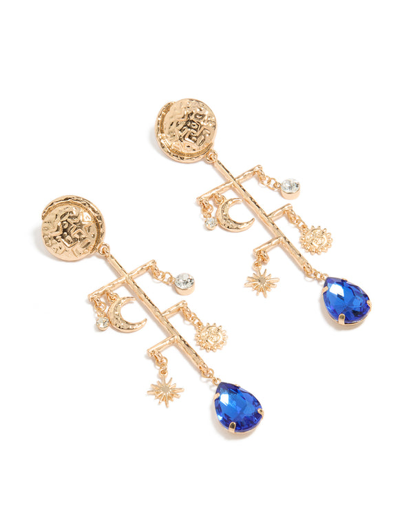 Featuring worn gold sun and moon marble drop earrings with celestial charm accents in statement style front view