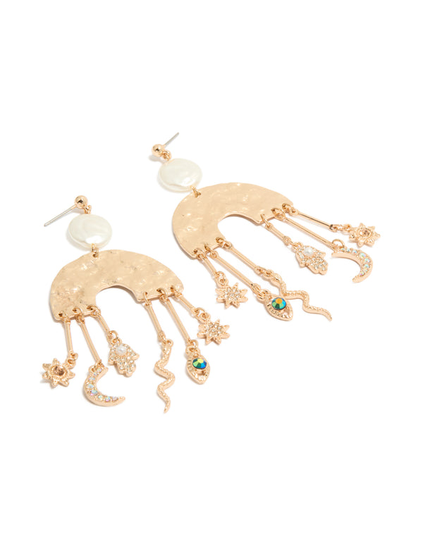 Showcasing brushed gold rainbow and celestial drop earrings with statement style featuring pearl, evil-eye, hamsa hand, snake, moon, sun, star charms with pearl front view