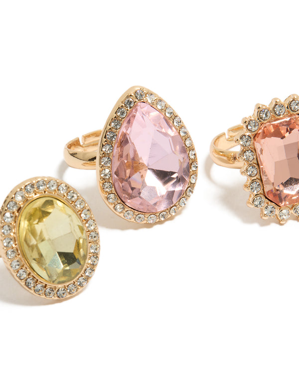 Featuring gold pink and purple pastel diamante rings in a 3-pack with halo and oval stone cut designed for statement style close up view