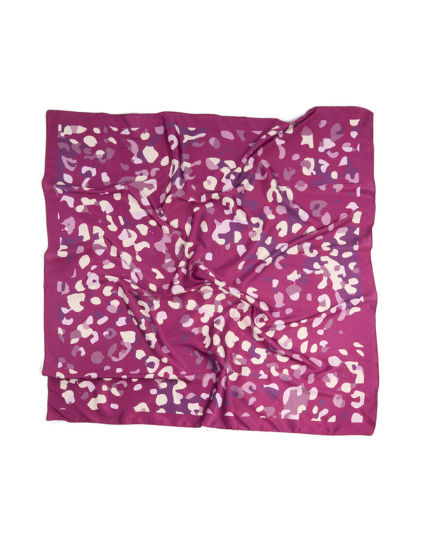 Featuring a berry pink fabric scarf scrunchie with leopard print in maroon, light pink, medium orchid, and bisque tones front view