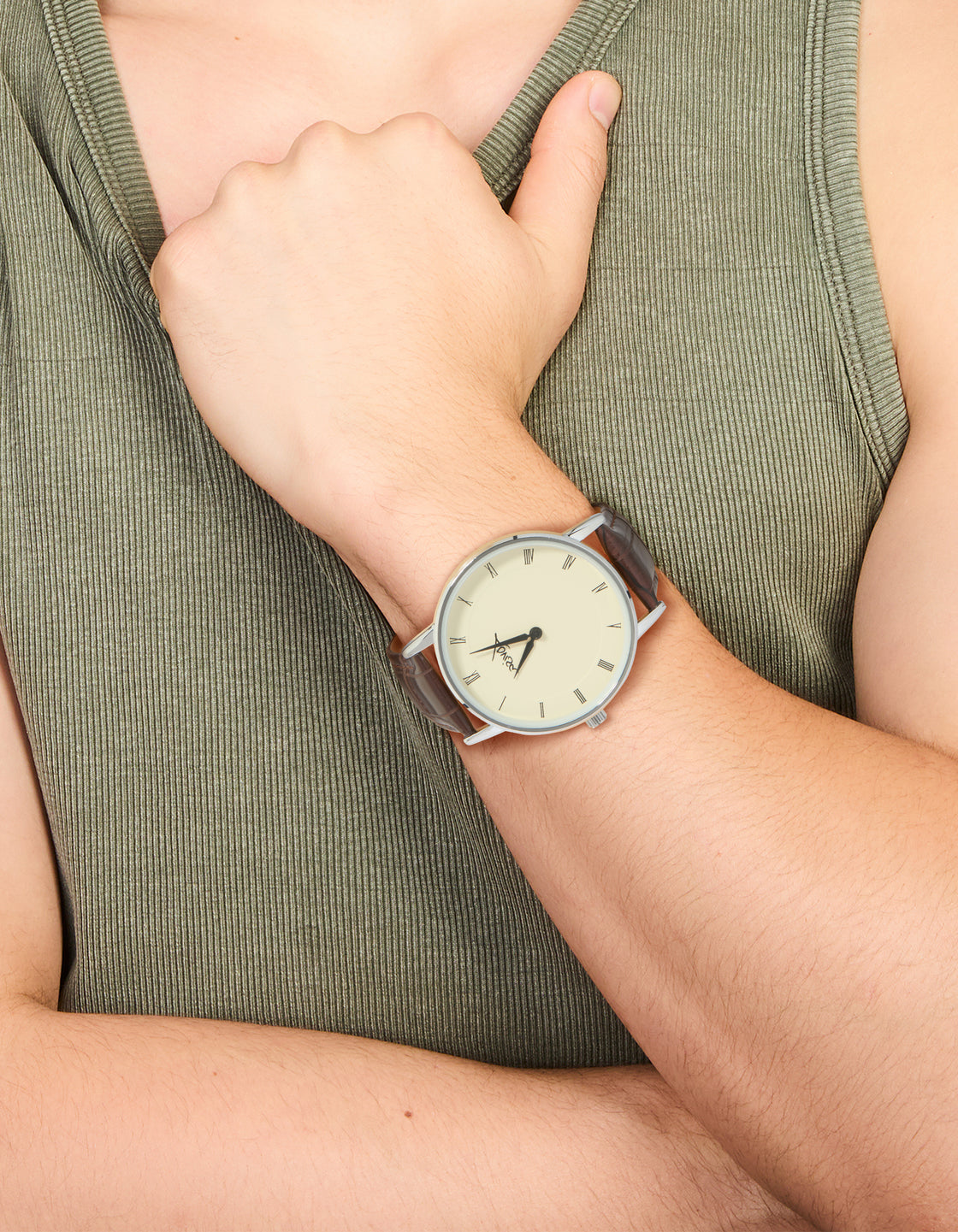 Designed with PU leather, this snake textured mens analog watch features a beige dial with roman numerals, round shape, formal styling, and brown strap on wrist view