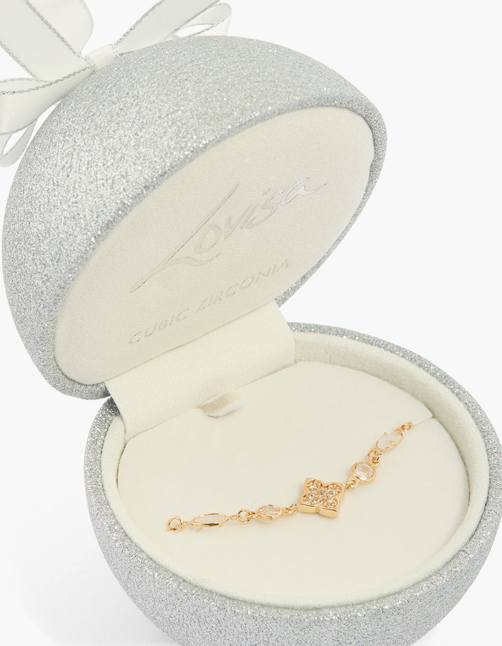 Showcasing a cubic zirconia bracelet featuring floral design with oval stone in gold close up view