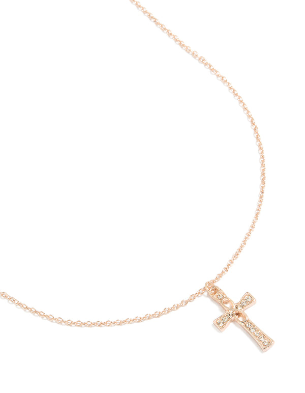 Showcasing a rose gold diamante cross pendant necklace featuring charm details close up view
