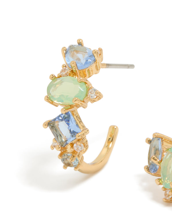 Showcasing gold plated blue and green cubic zirconia multi-shaped hoop earrings with sky blue and pale green stones in close up view