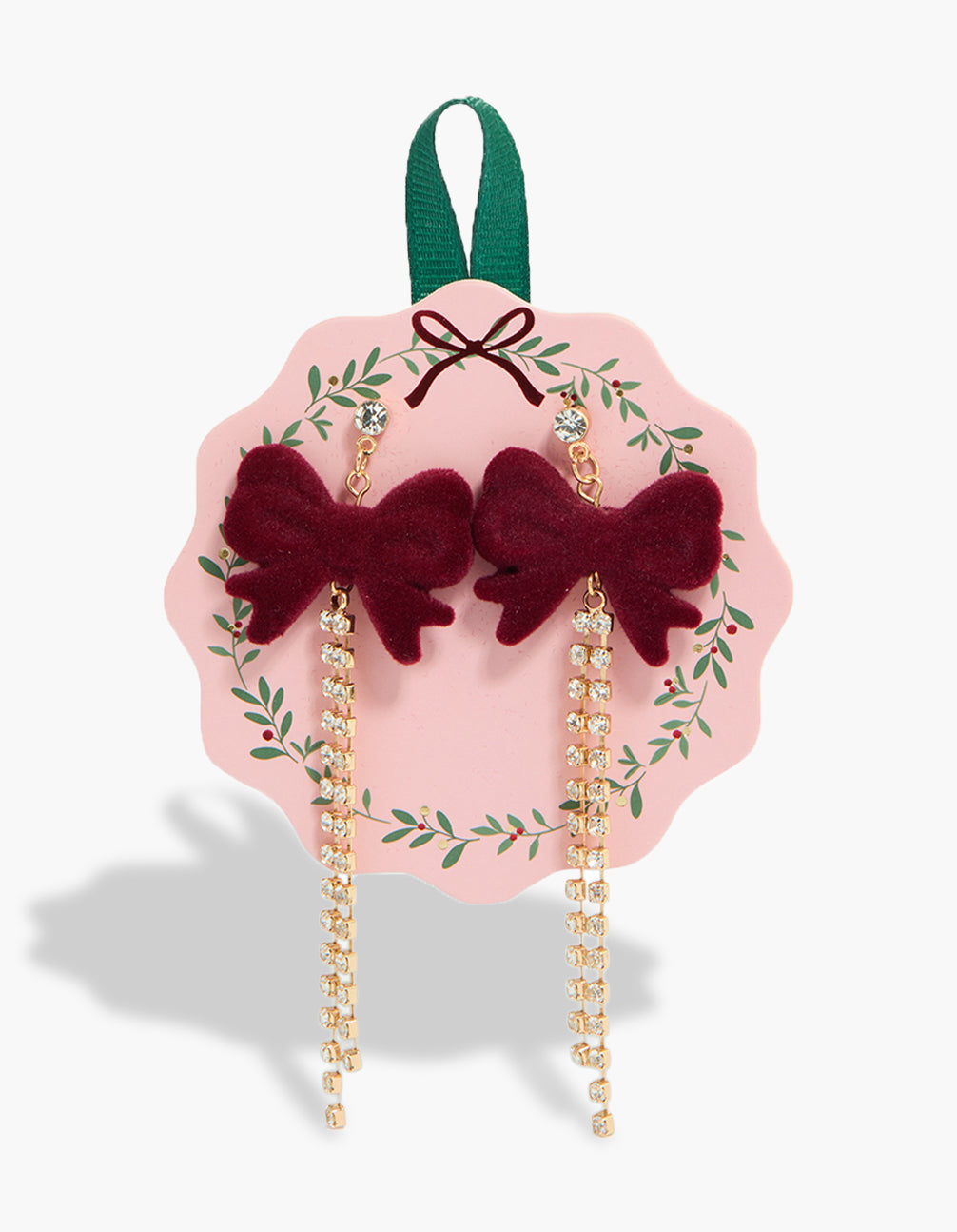 Featuring burgundy velvet bow drop earrings with diamante cup chain in gold front view