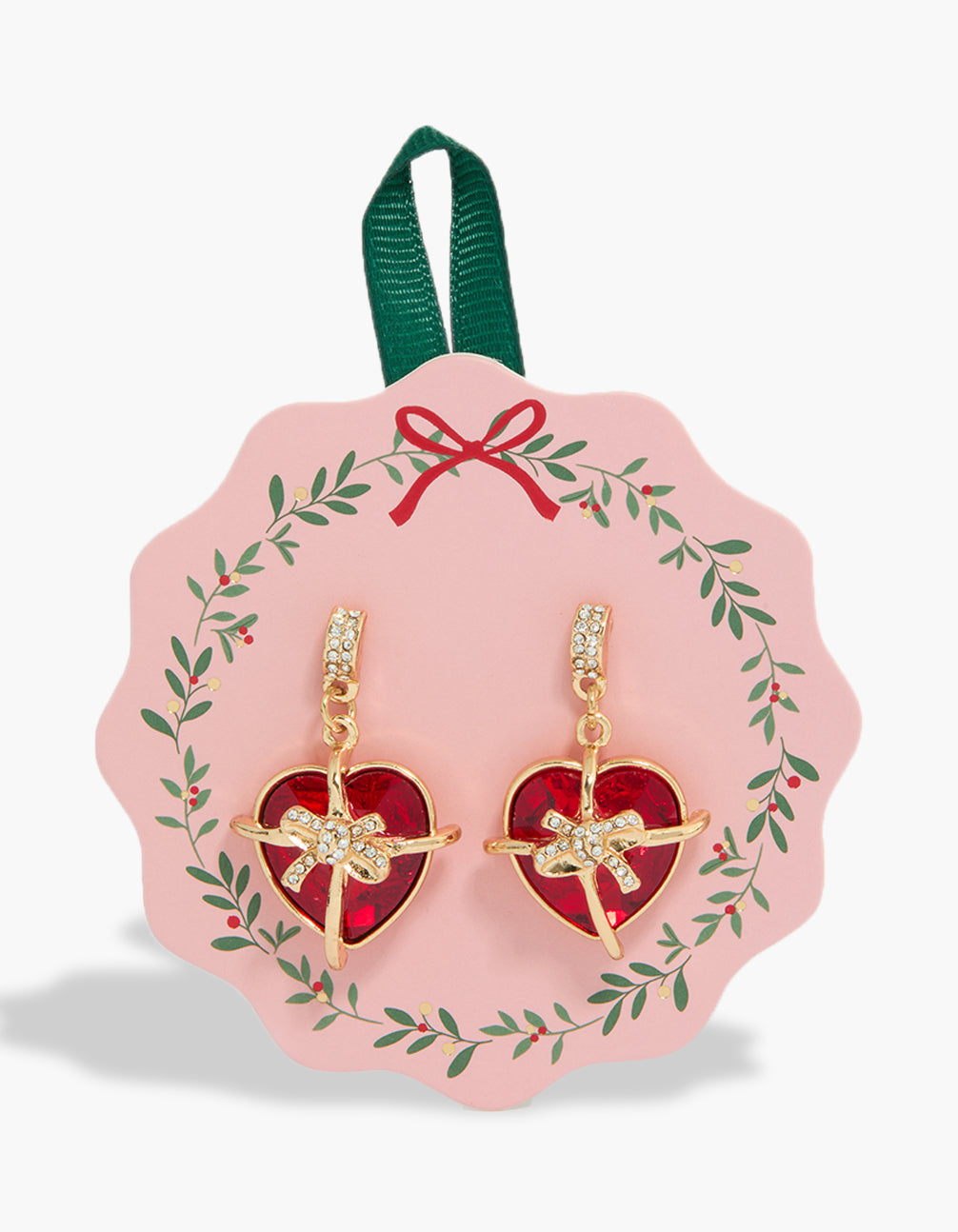 Showcasing statement bow wrapped heart earrings featuring gold accents front view