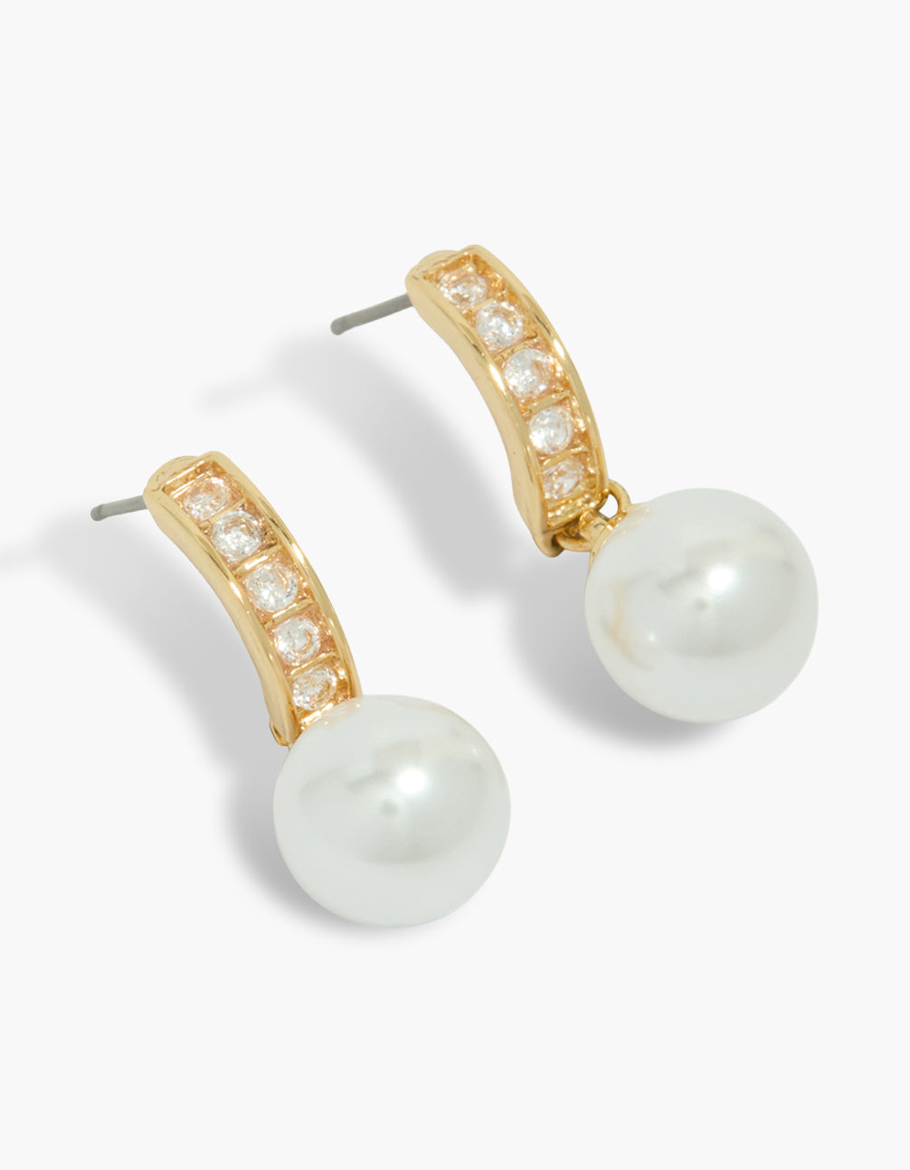 Explore gold plated pearl and diamante huggie earrings in white close up view