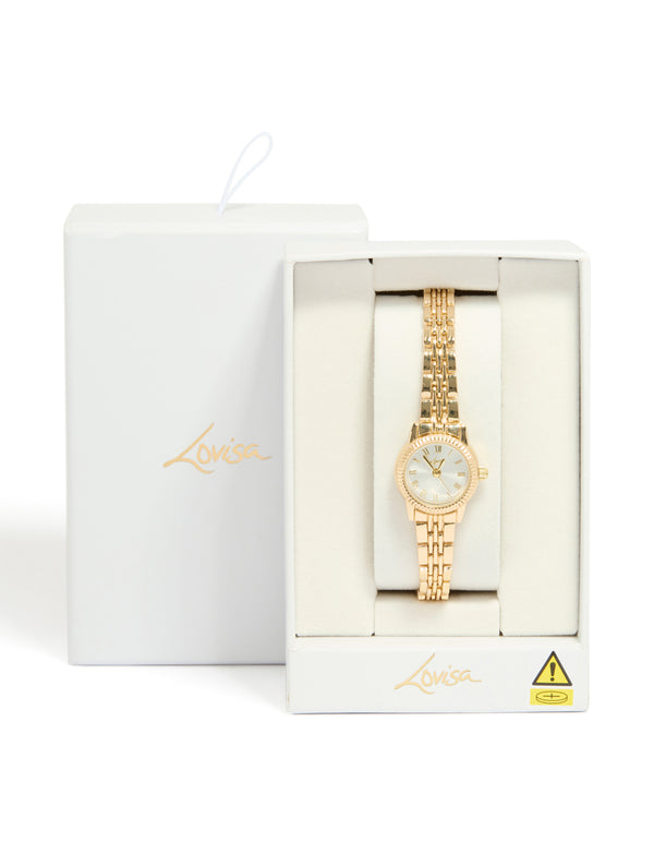 Beautifully designed gold plated mini round watch with white dial showcasing roman numerals, women's formal analog timepiece with link-band strap and statement styling, shown in packaging case detail view