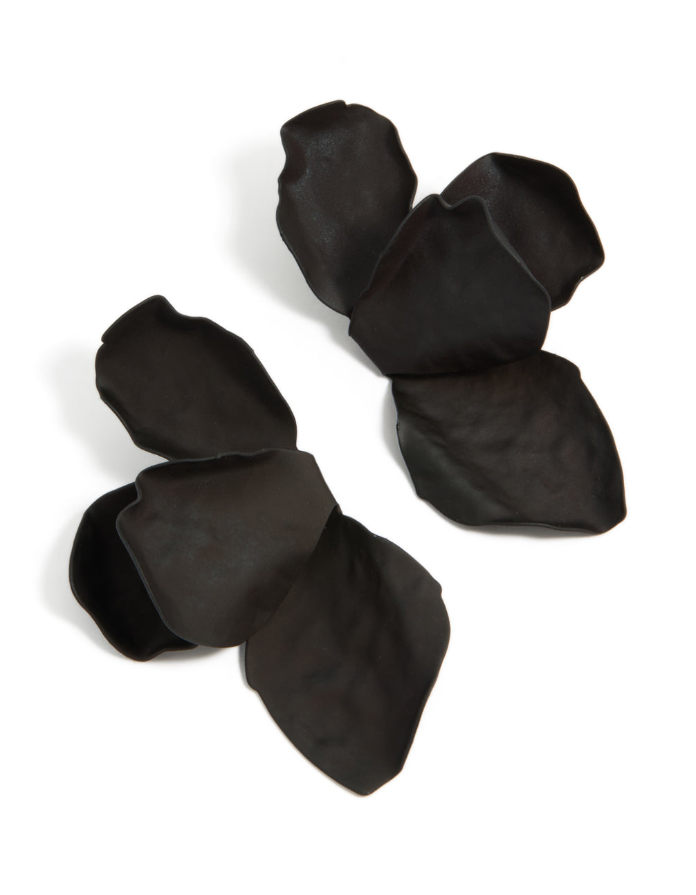 Showcasing statement floral black coated metal half flower petal drop earrings front view
