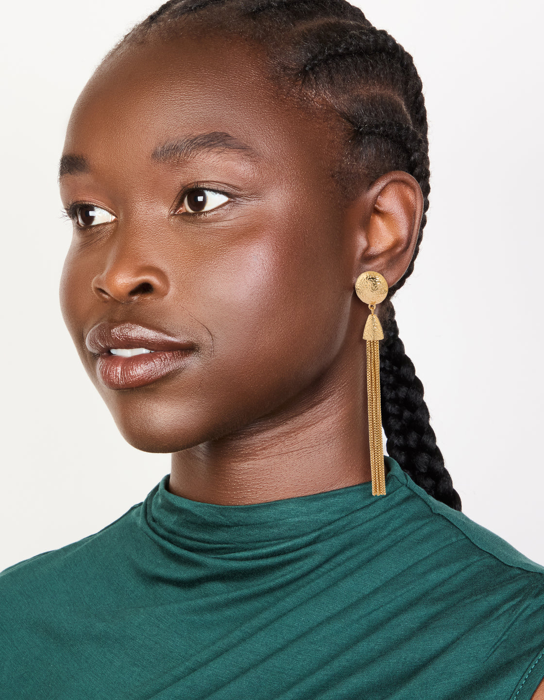 Featuring statement gold dome tassel drop earrings on model view