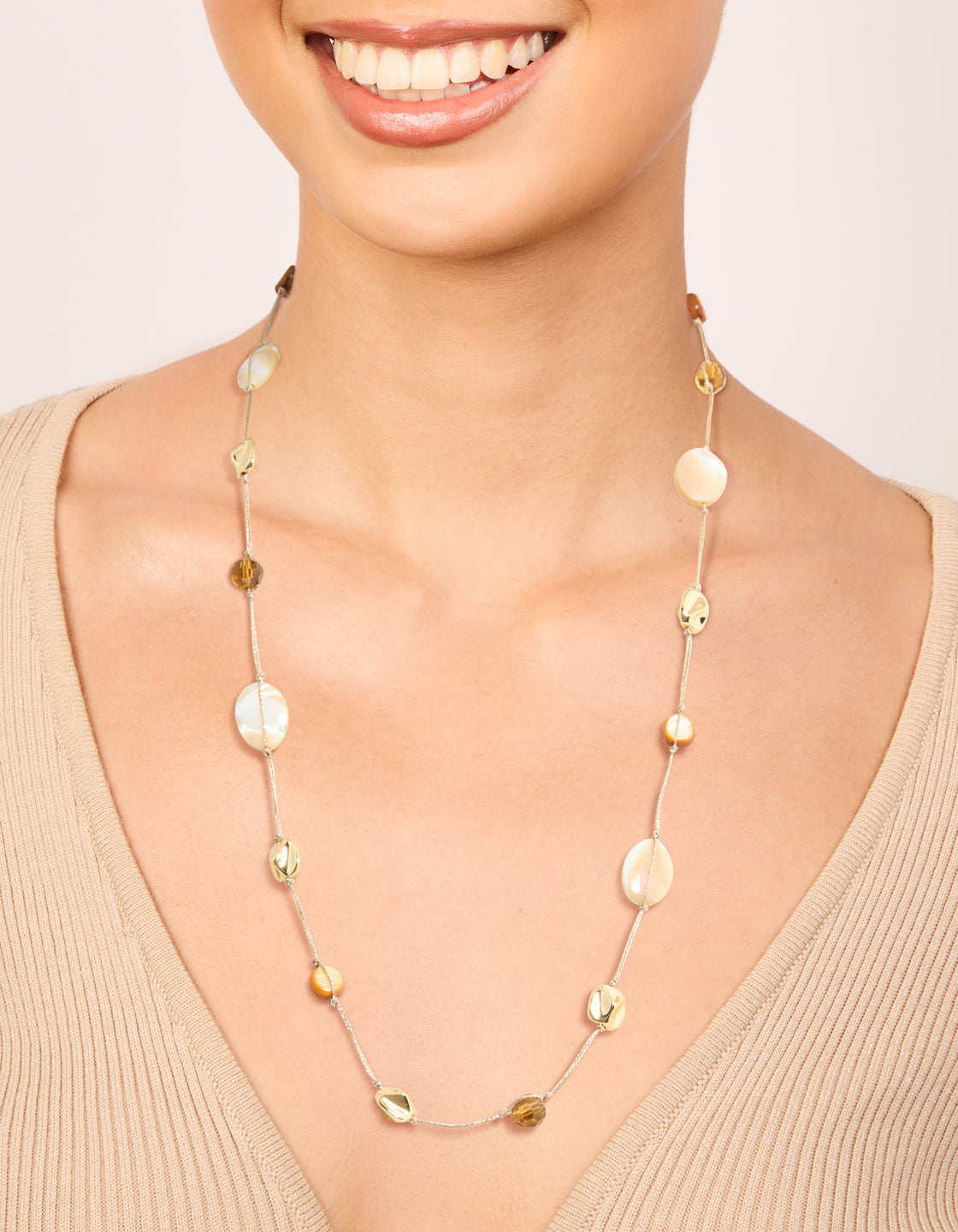 Crafted from gold plated brown and cream stone cord necklace with beads in statement style on neck view