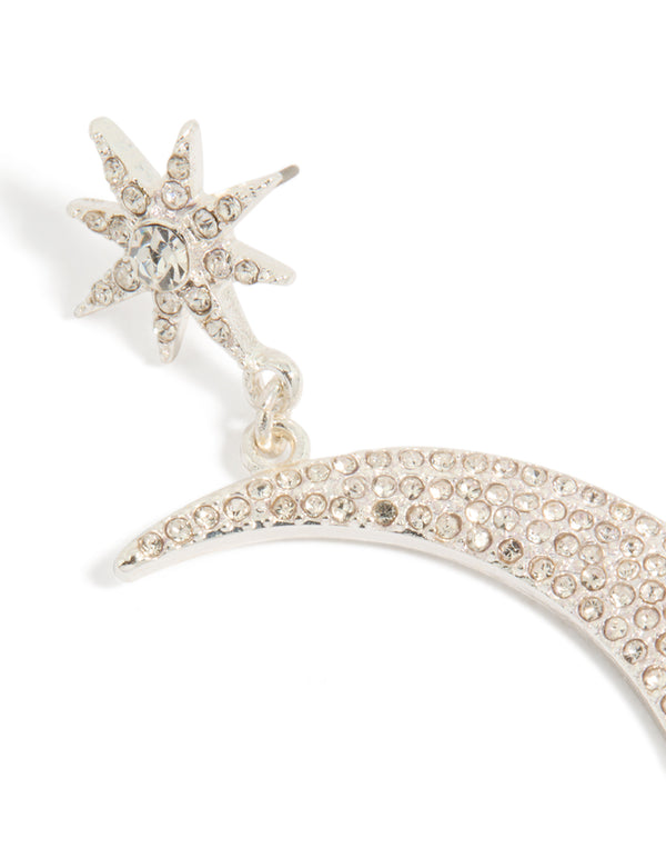 Crafted with diamante celestial star and moon drop earrings in silver with statement design close up view