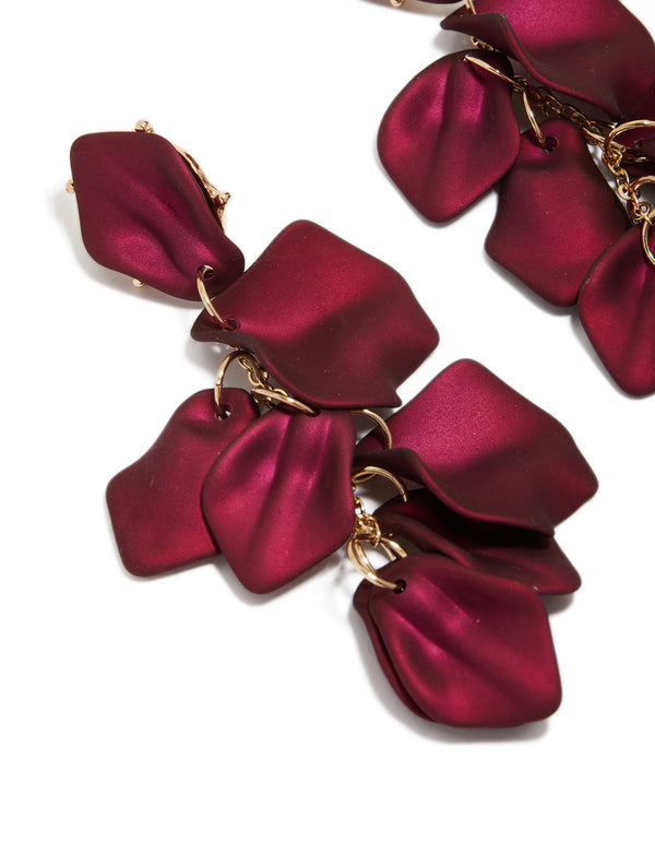 Designed with burgundy coated metal petal drop earrings statement design in maroon and gold close up view