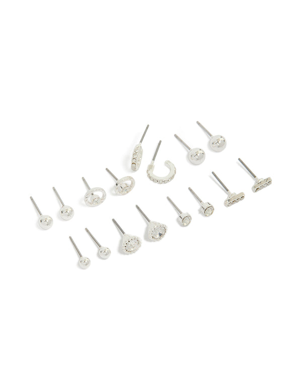 Showcasing mini hoop and stud earrings in an 8-pack featuring bar and balls design with silver closure front view