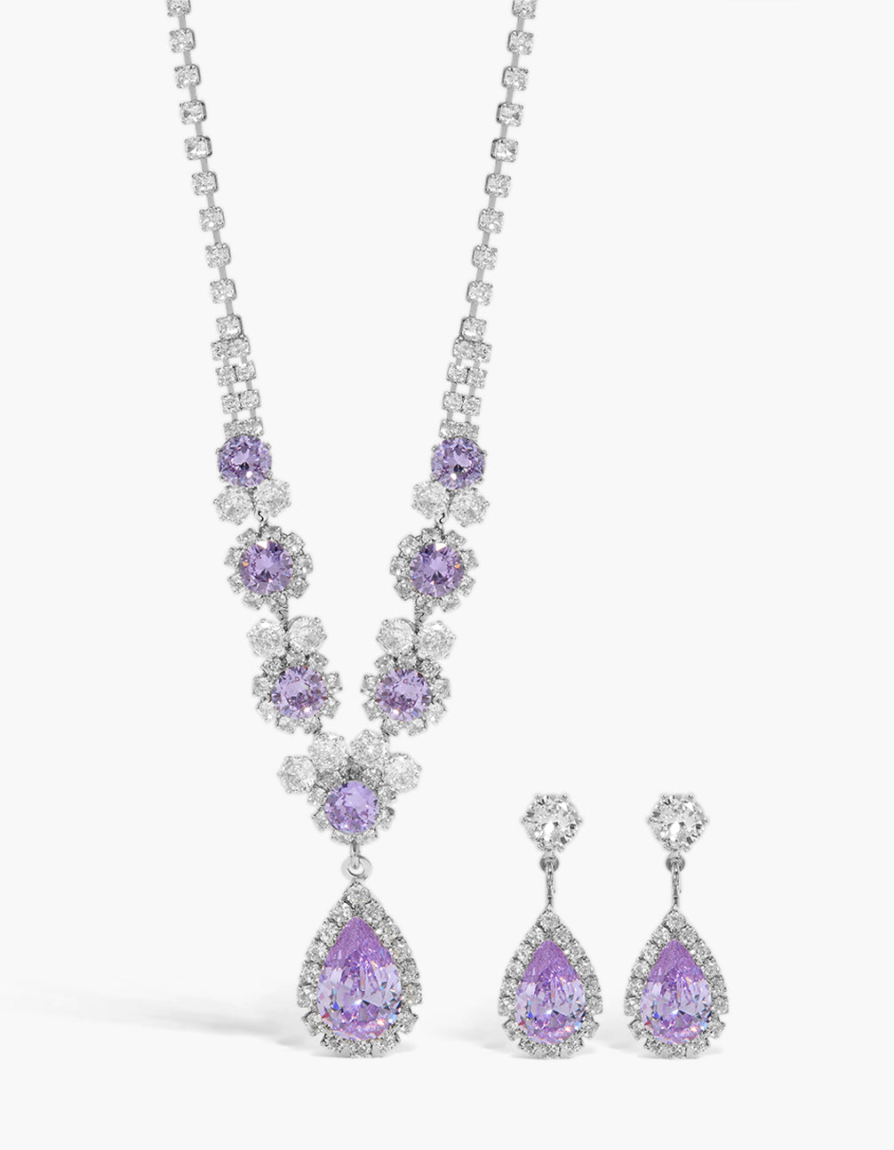 Showcasing a silver necklace and earrings set with lilac purple cubic zirconia close up view