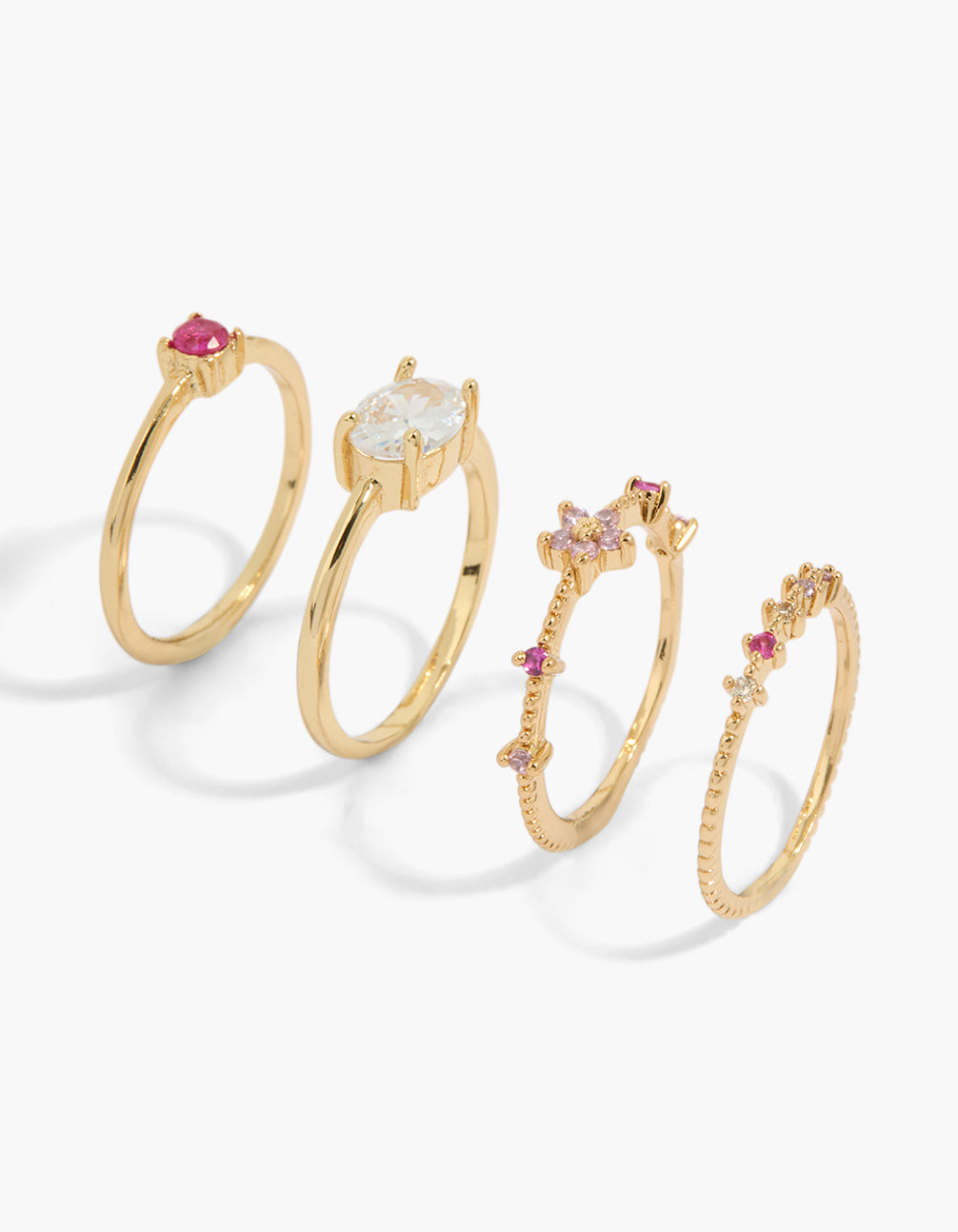 Beautifully crafted gold plated multicoloured cubic zirconia mini mixed flower rings 4-pack with oval stone cut in hot pink, clear, and lavender front view