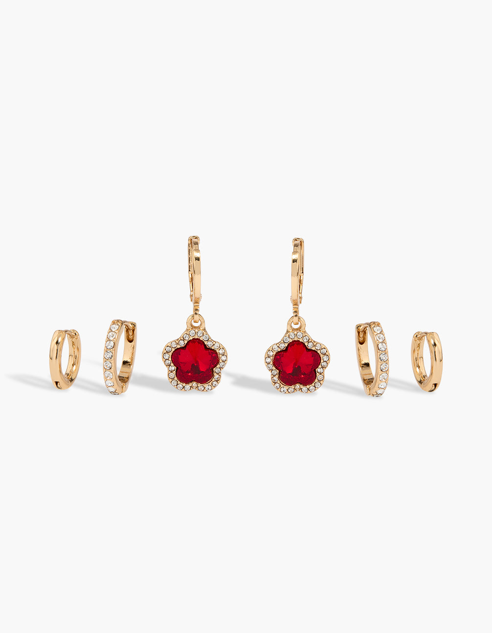 Showcasing floral huggie earrings in a 3-pack featuring red cubic zirconia with gold and clear accents front view