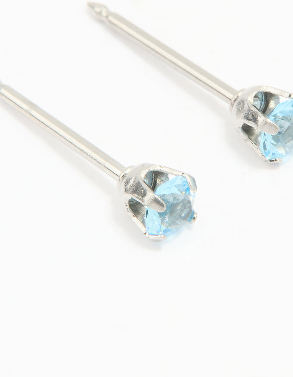 Featuring surgical stainless steel 3MM blue cubic zirconia piercing stud with sky blue stones and stud closure in silver close up view