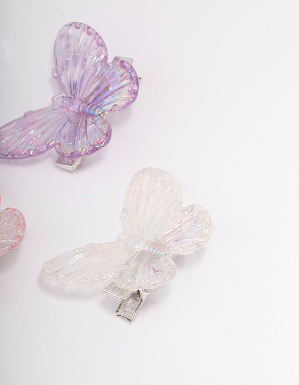 Elegant pastel iridescent butterfly hair clip 4-pack with glitter in plum, light pink, pale turquoise, and silver detail view