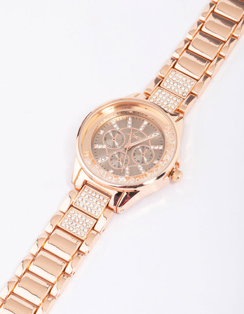 Beautifully crafted rose gold shaker diamante detailed watch with glitter accents, clear stone-look dial, round shape, chronograph design, link band strap, and formal occasion styling for women watch face detail view
