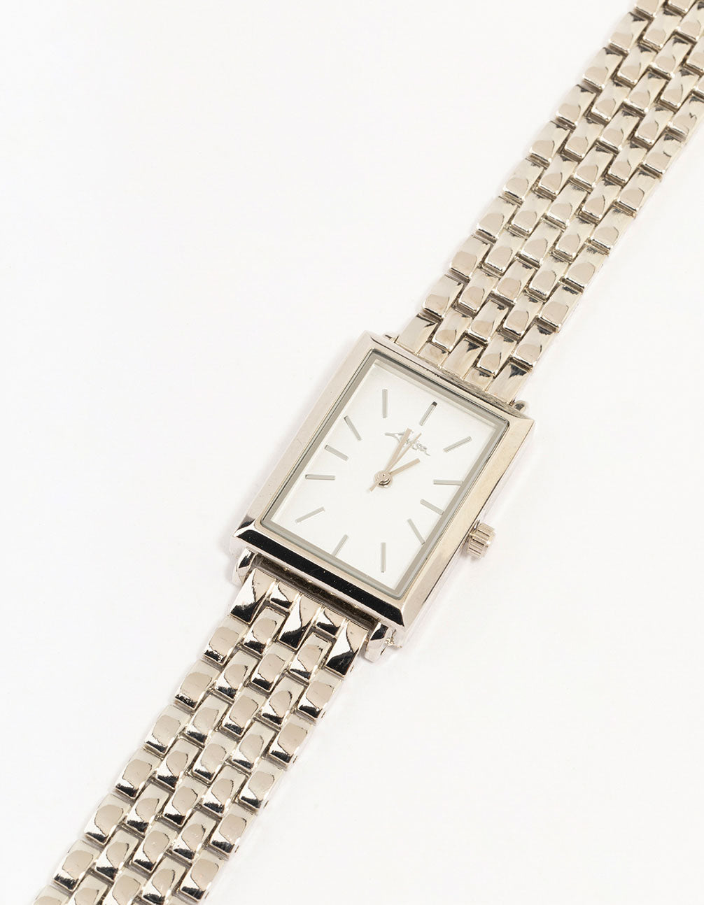 Elegant silver white rectangle watch with link band crafted for women featuring formal occasion styling and analog type watch face detail view